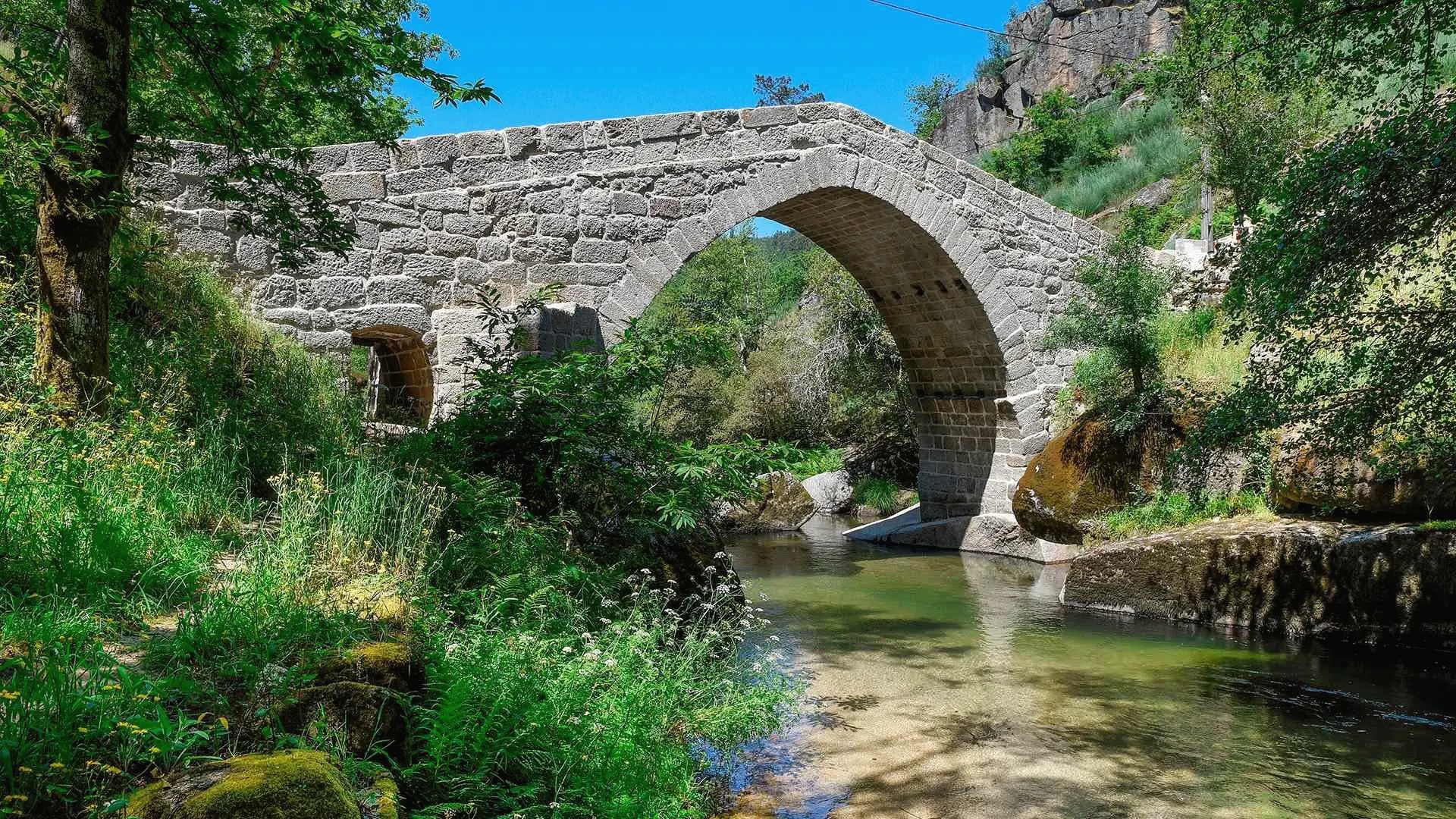 Ponte do Arco — a historic stone bridge over a quiet river in the countryside near Villa de Barros